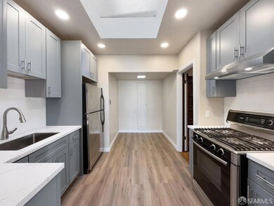 Newly remodeled kitchen includes recessed lighting
