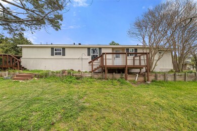 Back of house featuring a vegetable garden, brick 