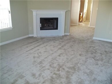 Large great room with new carpet & fresh paint.