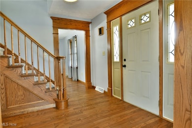 Foyer featuring hardwood / wood-style floors and stairway