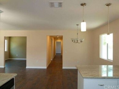 view from kitchen to dining area, den, hall