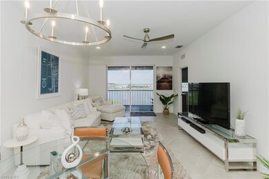 Living area featuring ceiling fan, light tile patterned floors, and recessed lighting