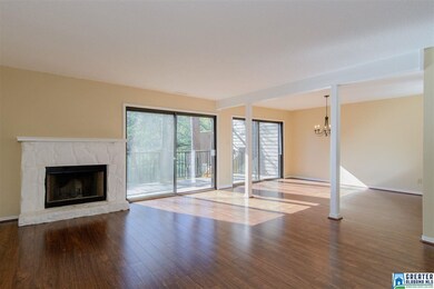 Open Living Area with updated hardwoods, fireplace