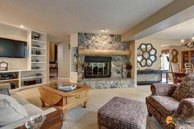 Stunning river rock & timber fireplace