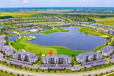 Drone / aerial view of a nearby body of water and a local golf course