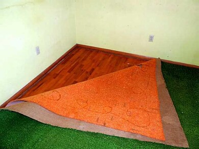Bedroom. Wood floors under carpet.