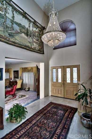 Double-door entry with cathedral ceiling, shows yo