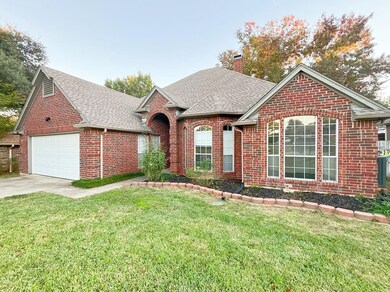 View of front of property featuring a garage and a