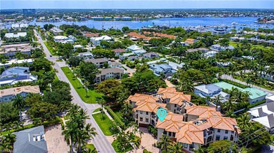 Birds eye view of property with a water view