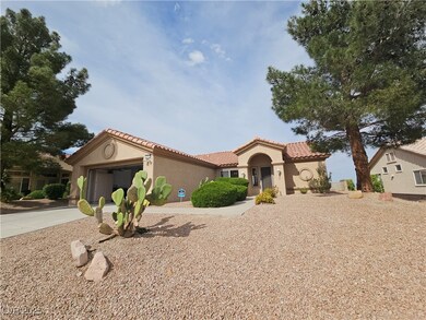 Mediterranean-style home with an attached garage,