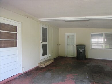 Double carport. There are 2 entry doors here.  One
