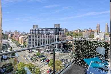 Balcony featuring a skyline view
