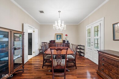 Dining space with crown molding, wardwood / wood-s