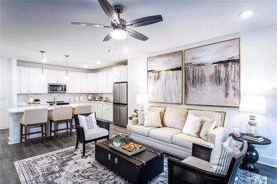 Living room featuring dark wood-style floors, a ceiling fan, recessed lighting, and baseboards