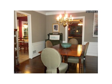 The formal dining room has gleaming harwood floors