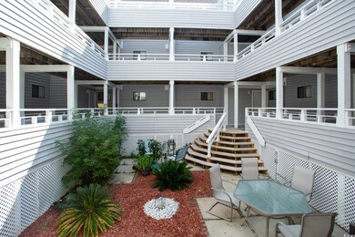 View of patio featuring a balcony