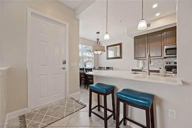 Kitchen featuring stainless steel appliances, back