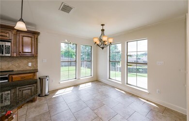 Dining area, Tile floors, Windows overlook backyar