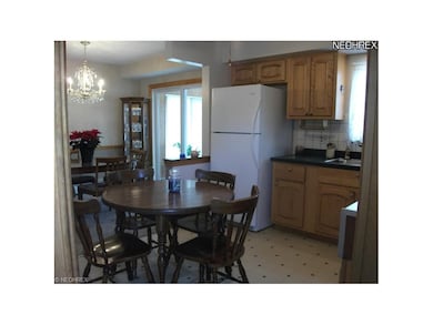 AS YOU ENTER THE SIDE DOOR TO THE KITCHEN