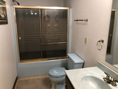 2nd full bath on upper level with double vanity.