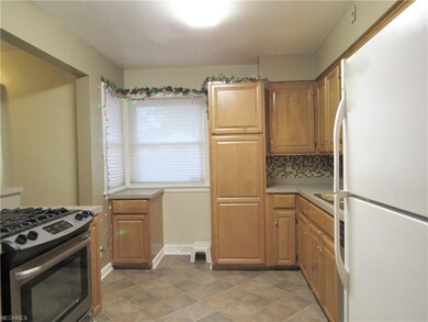 Updated maple cabinets in kitchen, with a gas stai