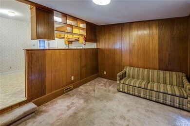 Family room off kitchen has siding glass door to f