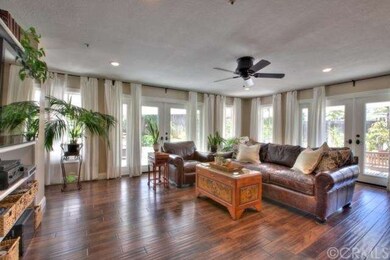 Family Room has French Doors and Custom Window Tre