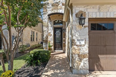 Doorway to property featuring stone siding