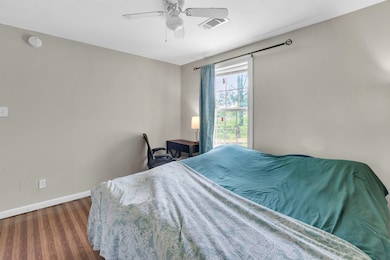 Bedroom featuring dark hardwood / wood-style floor