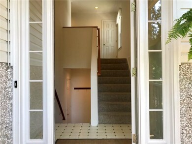 The front door opens to a bright and welcoming ent