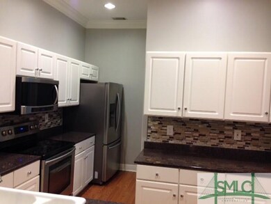 New stainless appliances and back-splash.