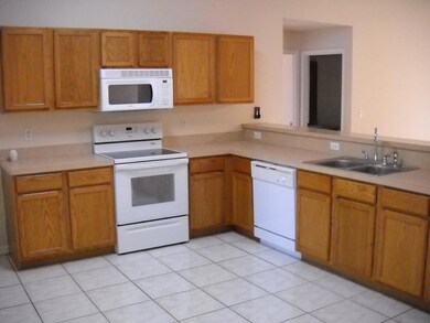 Modern kitchen with tile flooring