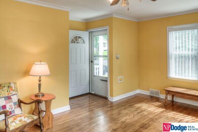 Note the bright room and refinished original wood flooring!