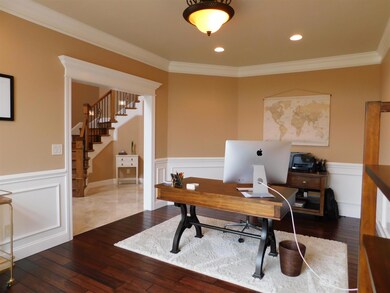 This living room is currently being used as a study/office.
