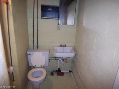 This is a full bath in the basement. Commode, sink