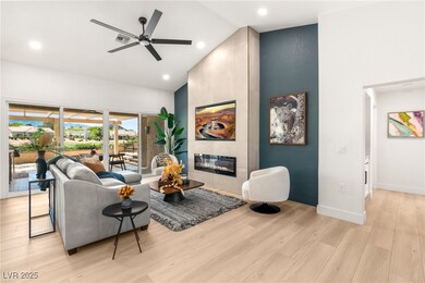 Living area with high ceiling, tiled & electric fi