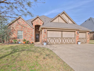 Single story home featuring a garage, a front yard