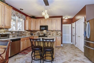 Kitchen with pantry on right and laundry behind fa