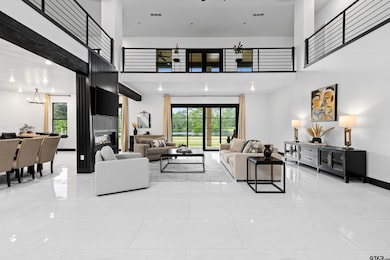Living room with an inviting chandelier, plenty of