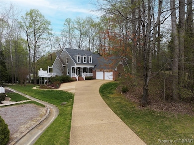 View of front of property with a porch, an attache