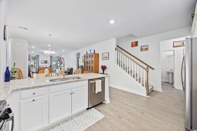 Kitchen with sink, light wood-type flooring, stain