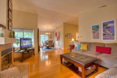 Open Living Area with Fireplace and Hardwood Floor