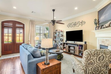 Living room with ornamental molding, hardwood / wo