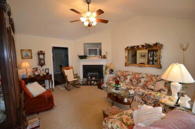 Great Room With Gas Logs And Vaulted Ceiling