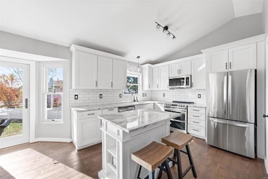 Light Filled Kitchen w/White Shaker Style Cabinetr