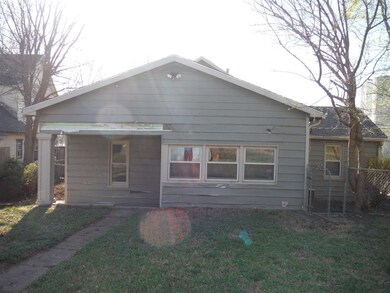 View from 1st Street showing front porch.