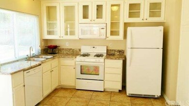This kitchen is beautiful with granite counter top