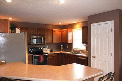 Tile Floor, angled Breakfast Bar, stainless applia