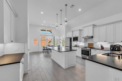 Bright, Open Kitchen with Seamless Dining Flow:  D