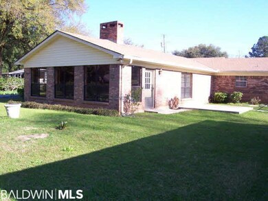 Sunroom on back looks out to beautiful yard. This back addition was built in 1978 and added over 850 sq ft and the custom fireplace and den.